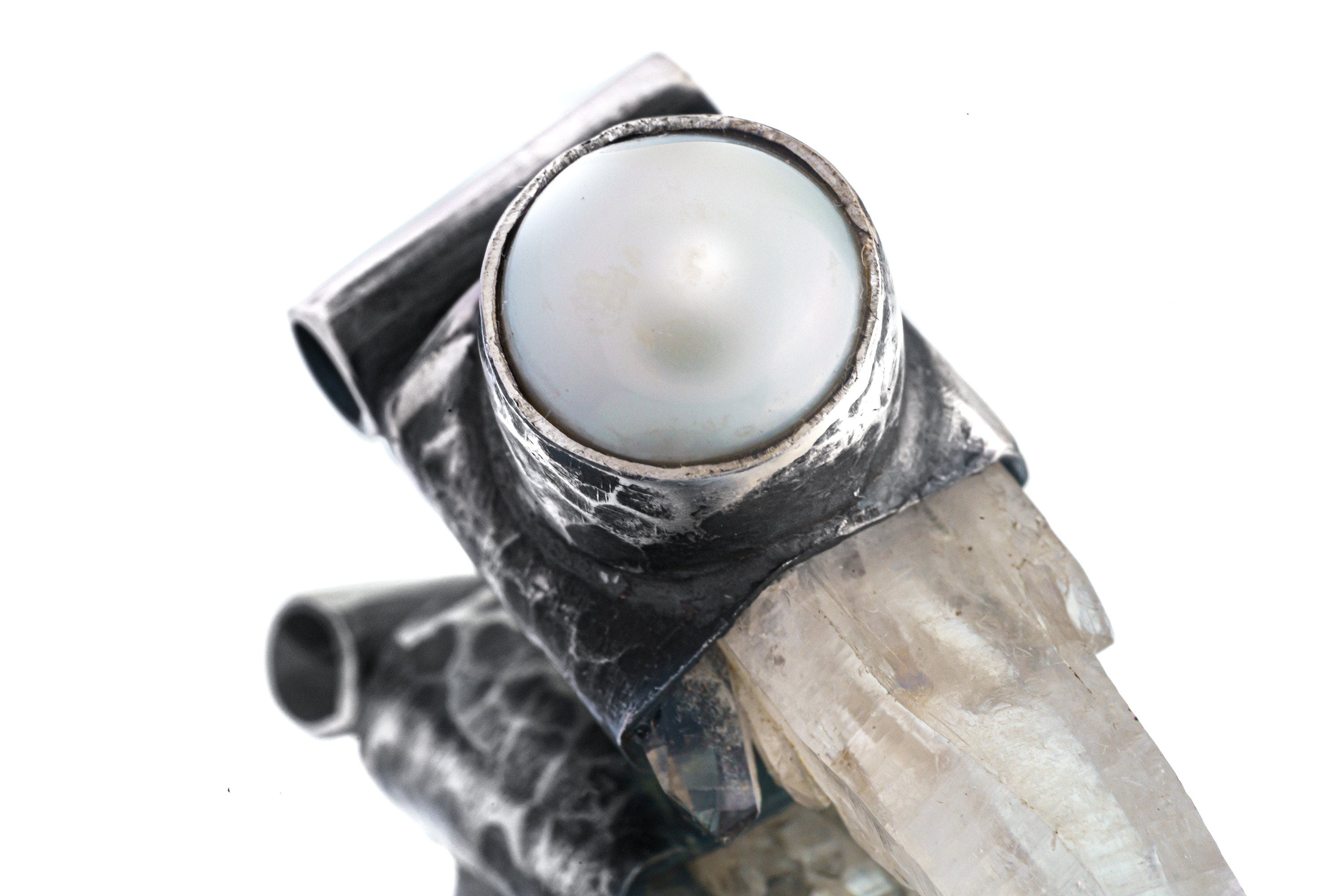 Close-up of old South Sea Pearl set above Nepal Clear Quartz in an oxidized sterling silver Stack Pendant cap.