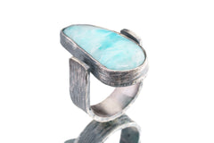 Side view of Larimar ring showing rock-hammered oxidized sterling silver, raised bezel setting, and strong profile.