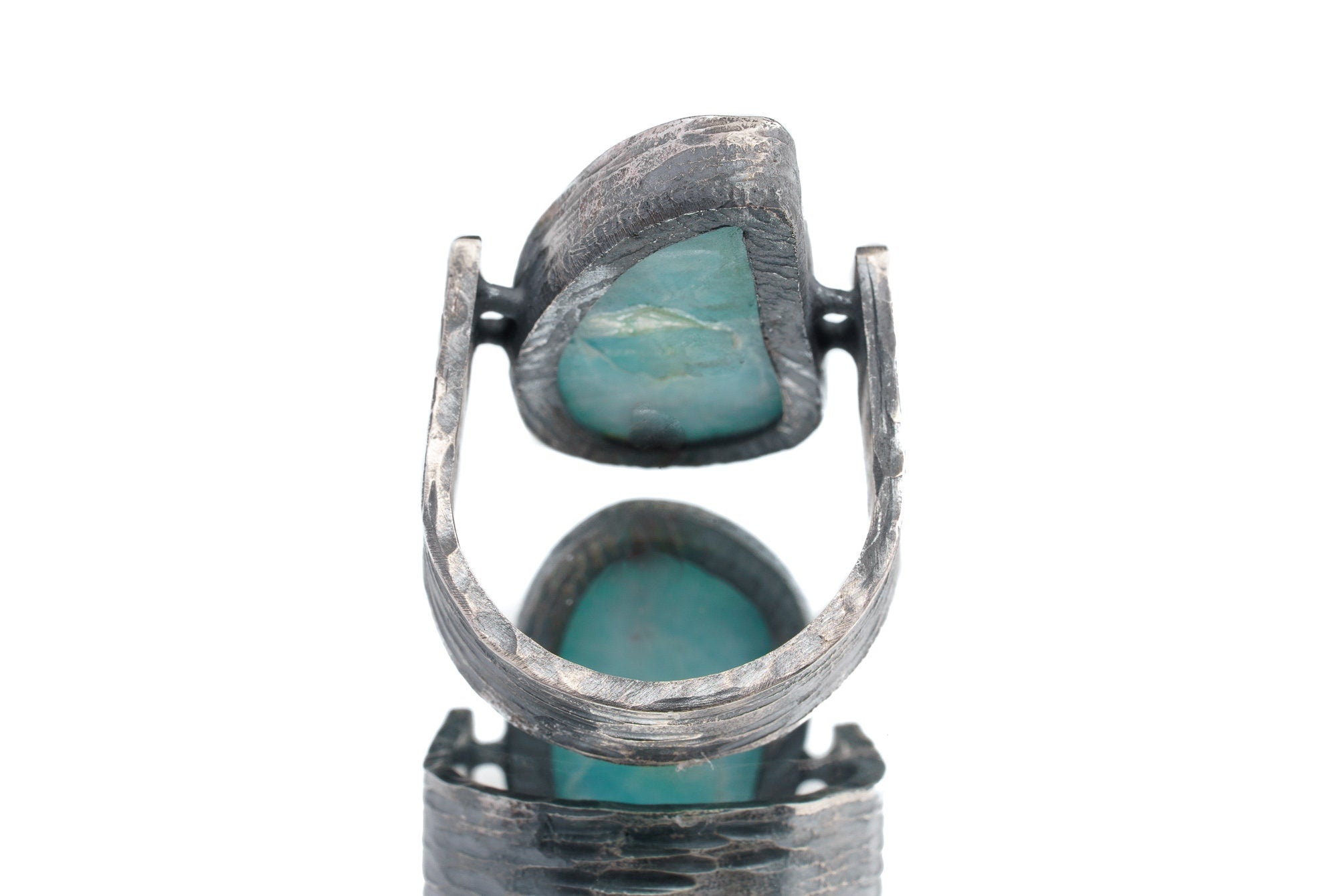 Back view of Larimar ring showing open-back bezel construction and oxidized rock-hammered sterling silver band.