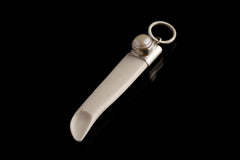 South Sea Pearl Antique Bone Spoon Pendant shown on dark background with sterling silver cap and carved bone scoop.