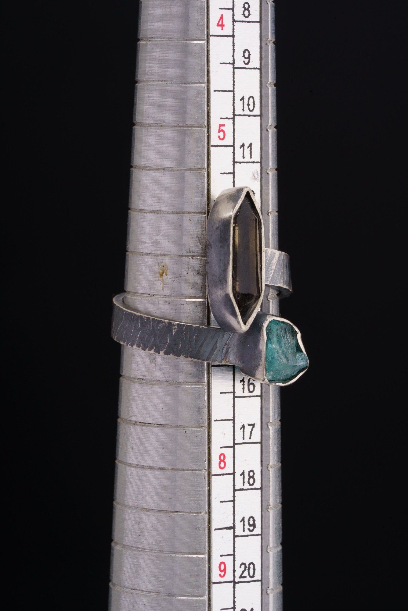 Smoky Quartz Blue Apatite ring shown beside a ruler for scale, with adjustable 925 sterling silver band.
