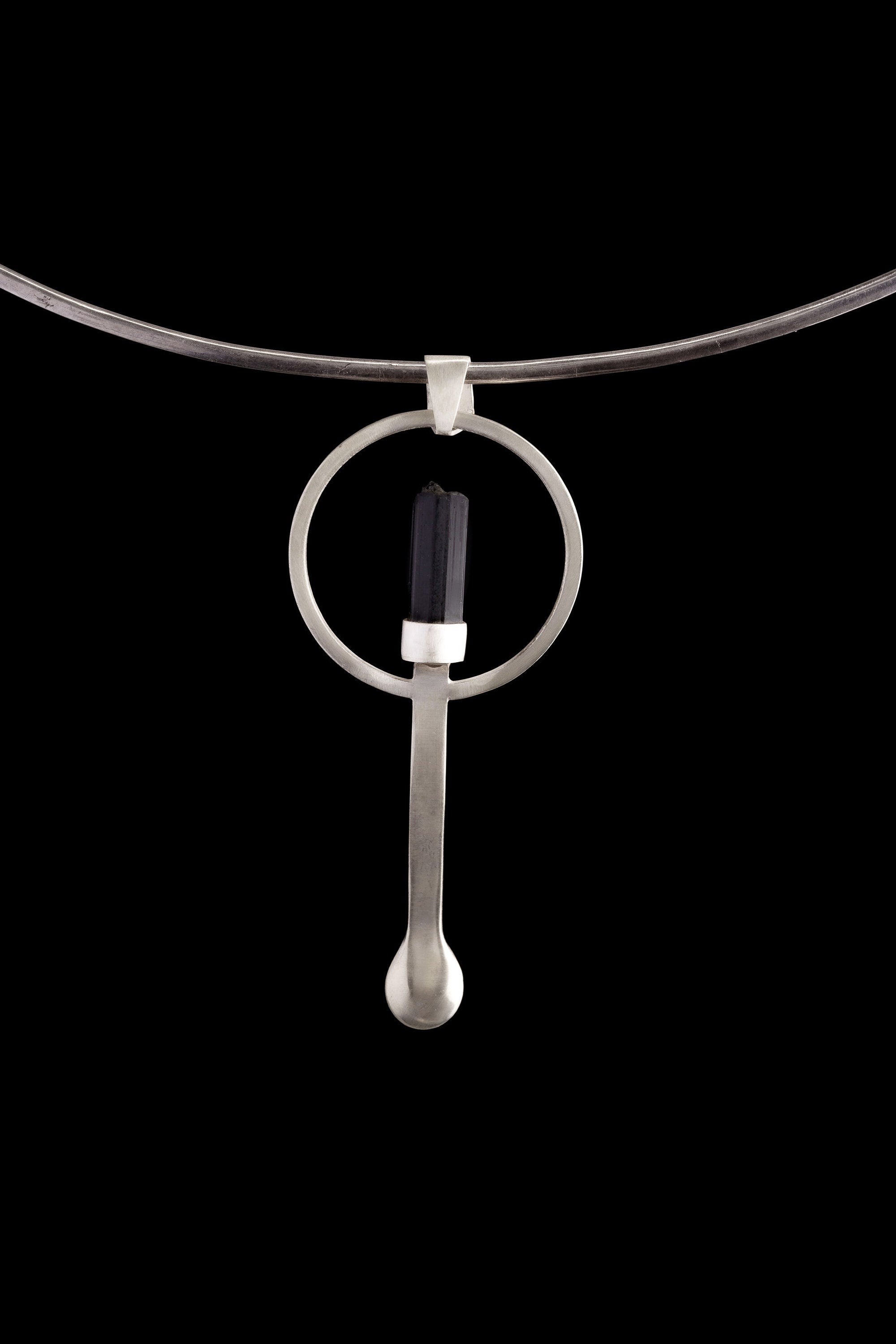 Black Tourmaline silver ritual spoon displayed on a choker, showing wearable talisman styling and spoon form.