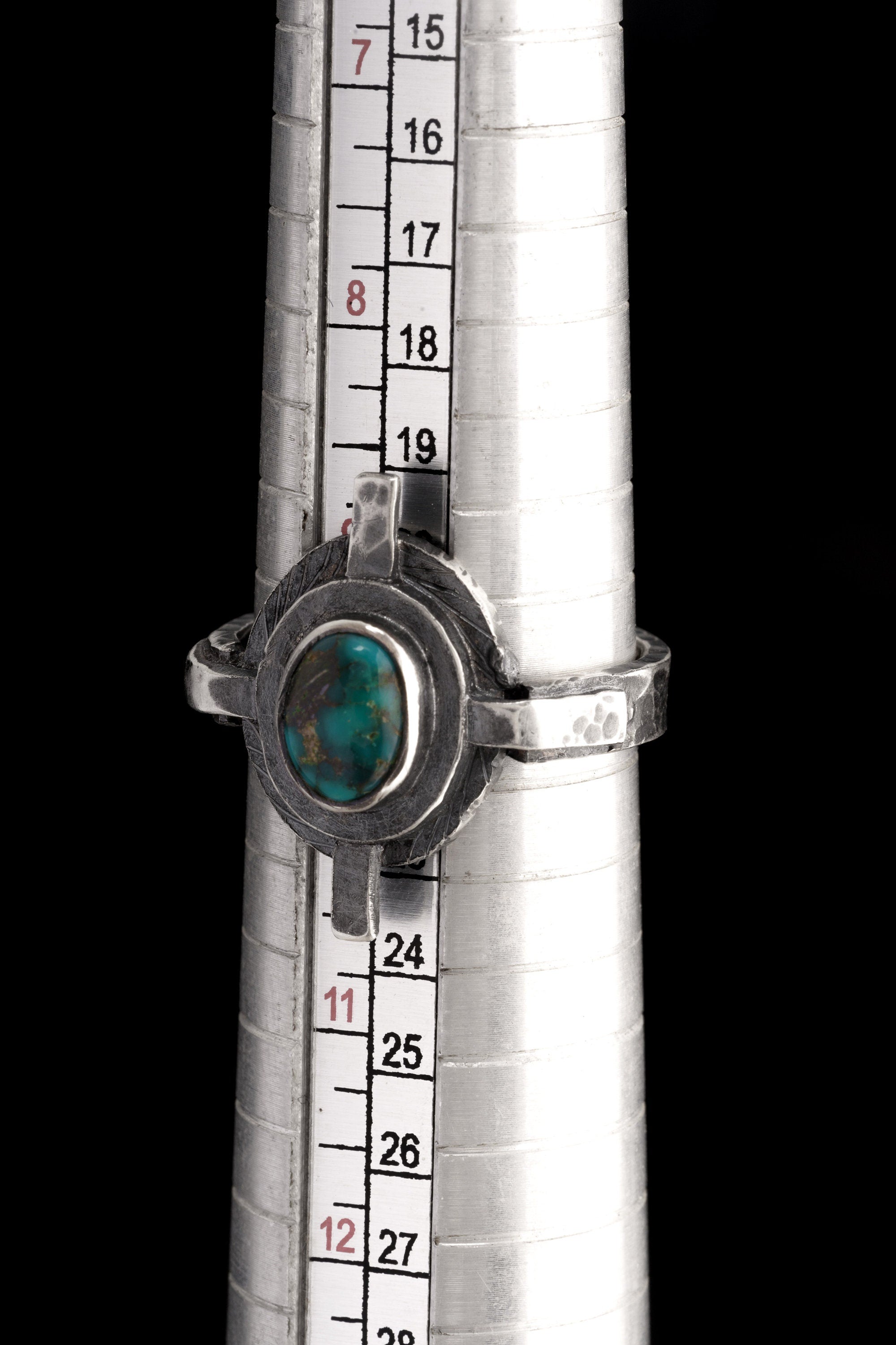Himalayan Turquoise Compass Ring shown beside a ruler for scale with textured sterling silver and old Turquoise stone.