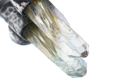 Close-up of Nepal Inclusion Quartz showing green internal mineral character and natural crystal clarity.