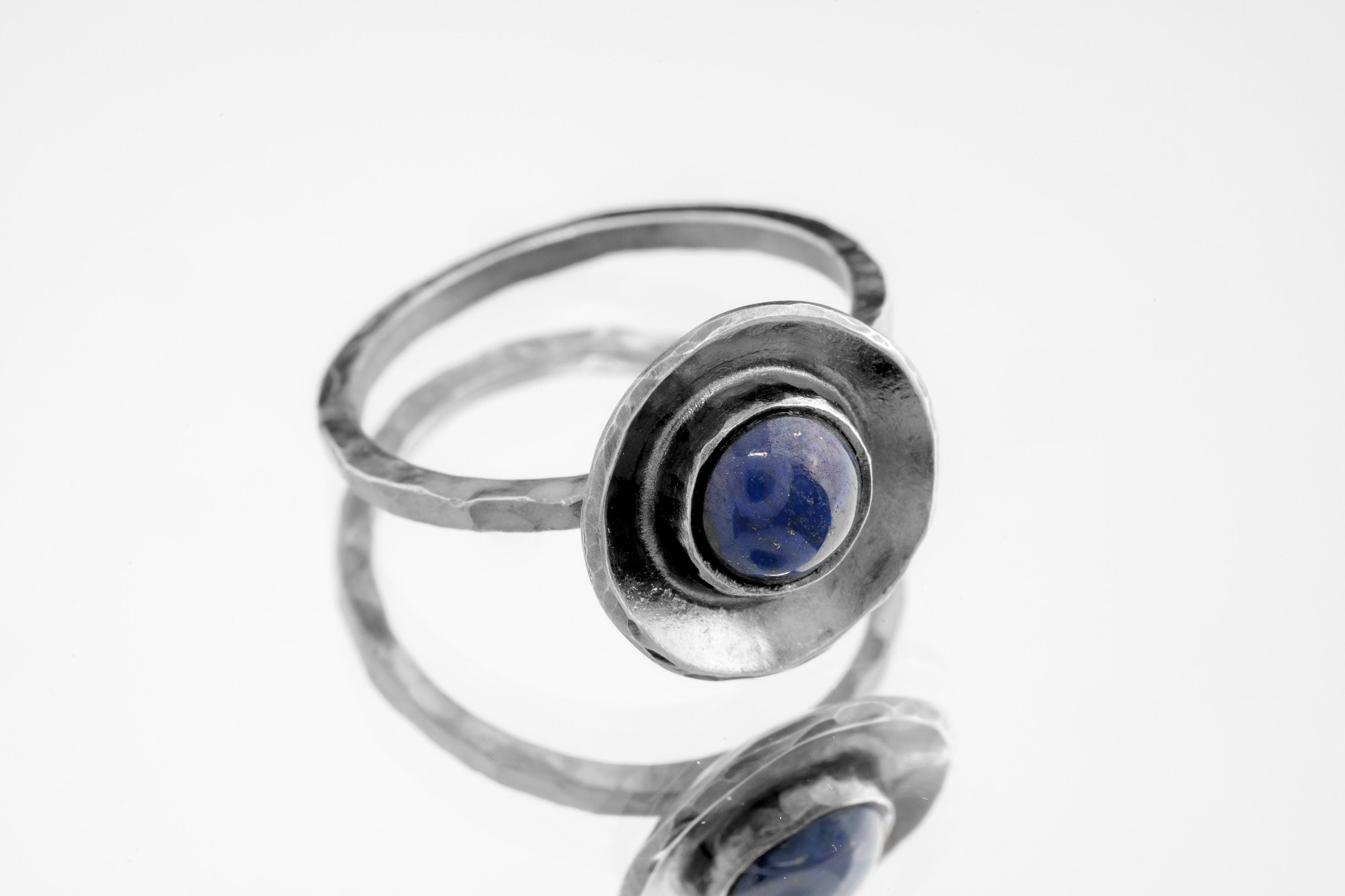 Side view of Lapis Lazuli dome ring showing the round blue stone, raised silver profile, and handmade band.