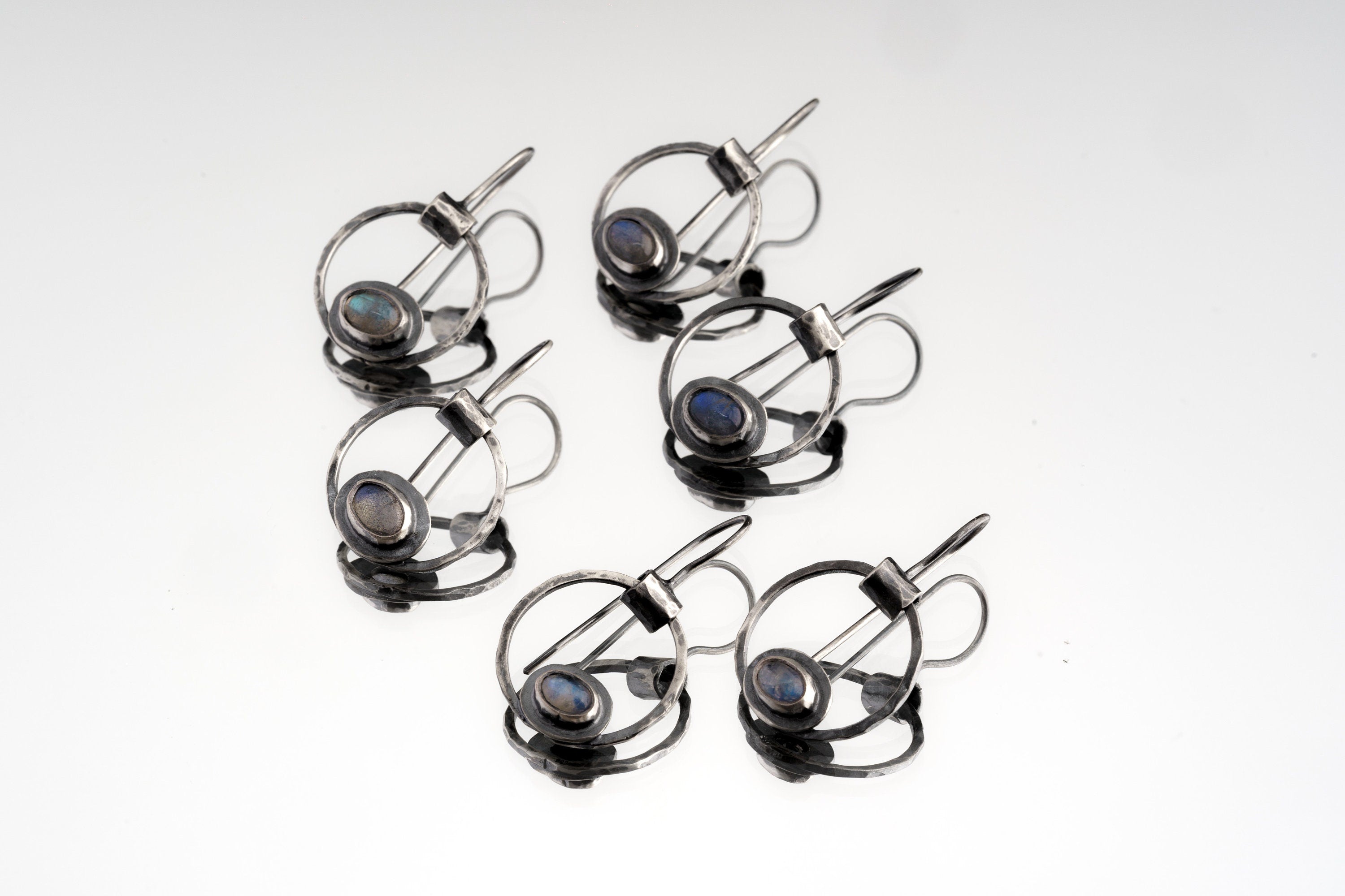 Labradorite Cat Eye earrings displayed as a matching pair with rustic sterling silver and mystical eye-shaped design.