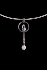 Raw Aquamarine ritual spoon displayed on a choker, showing wearable talisman styling and oxidized sterling silver form.