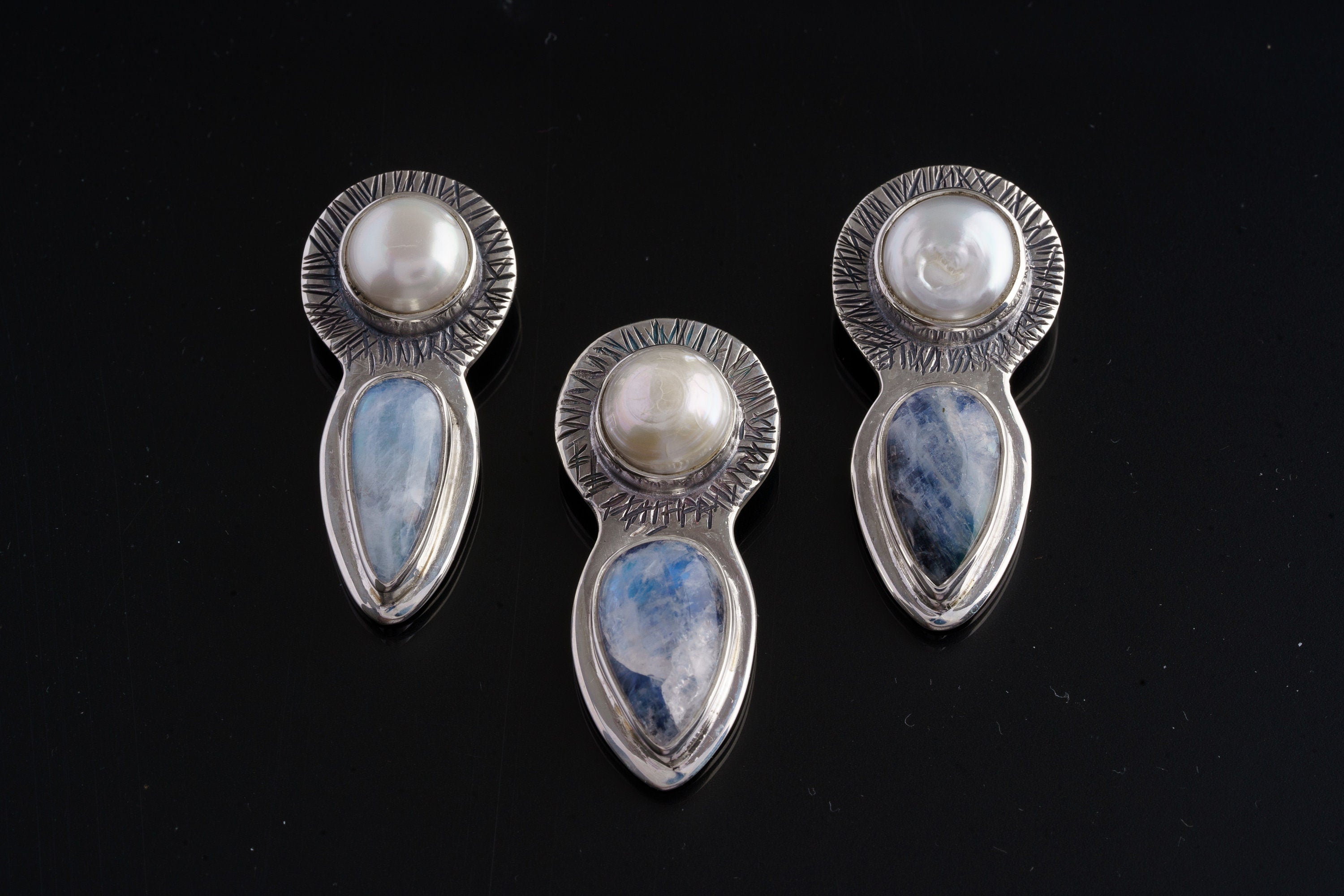 Limited Venus Moonstone Pearl pendants shown as a group with South Sea Pearl and teardrop Blue Moonstone.