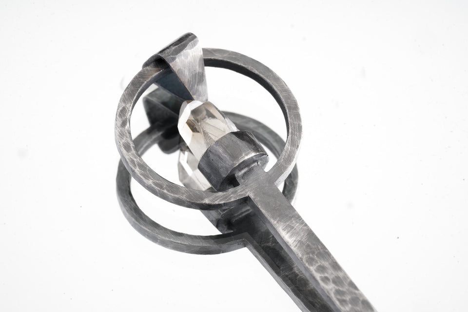 Close-up of raw Aquamarine ritual spoon showing hammered oxidized silver texture and pale blue-green crystal.