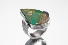 Side view of Chrysoprase Abstract Ring showing oxidized silver texture, raised bezel setting, and solid band construction.