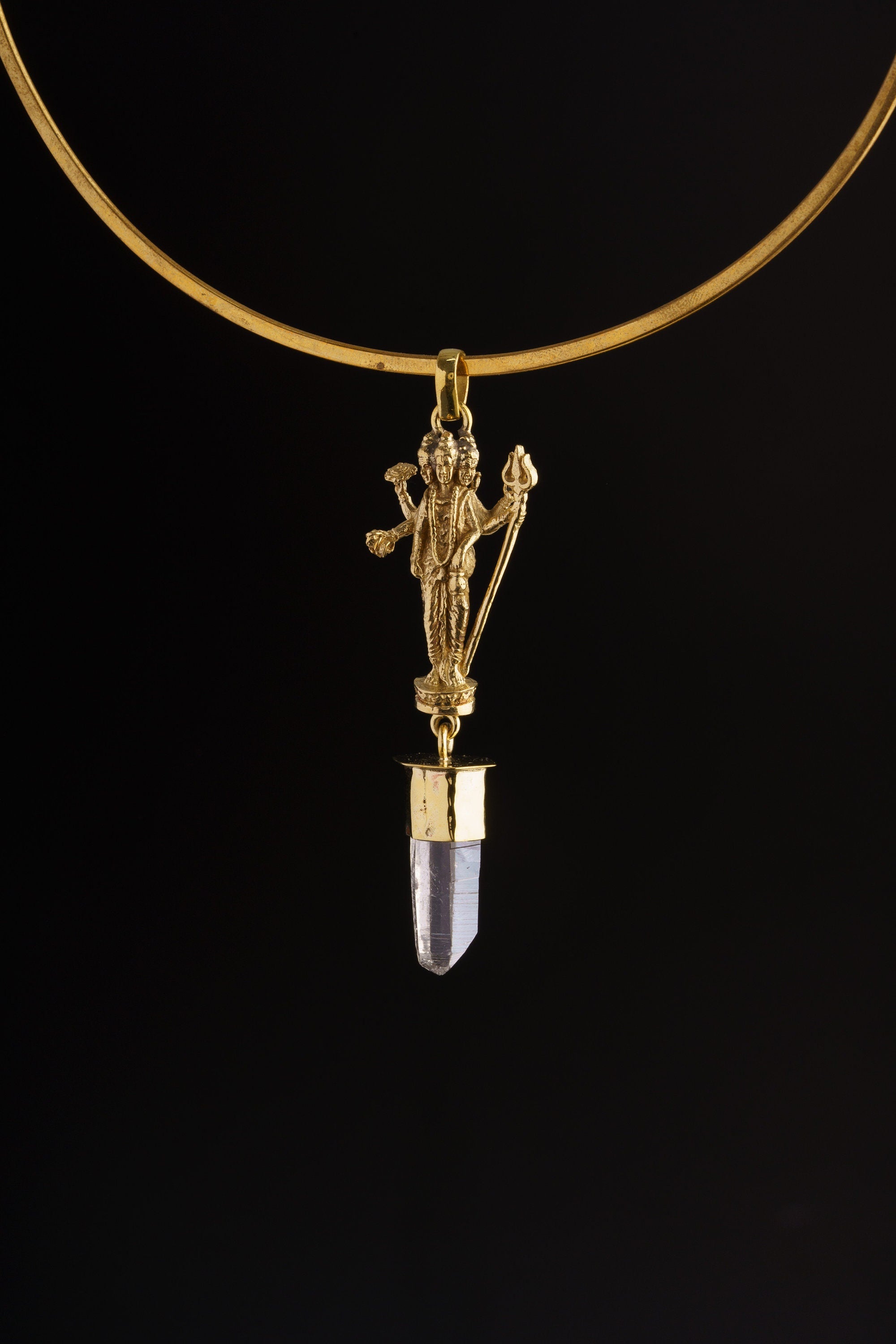 Lord Shiva Clear Quartz pendant shown worn on a black background as a lightweight brass spiritual necklace.