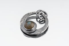 Single Rainbow Labradorite crescent pendant in oxidized sterling silver with hammered moon texture and dual oval bail.