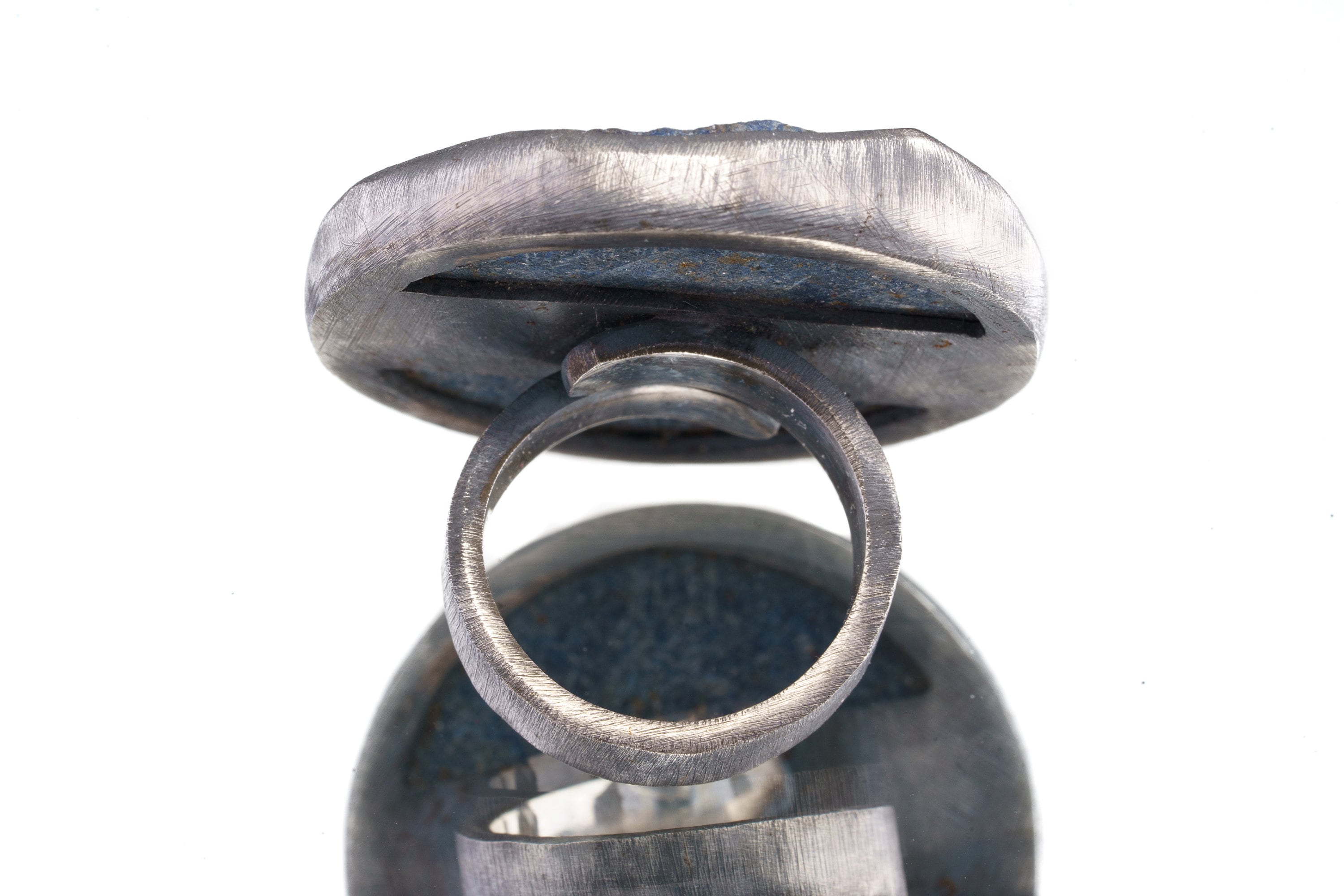 Back view of XXL Lapis Lazuli statement ring showing thick sterling silver setting and large round blue stone.
