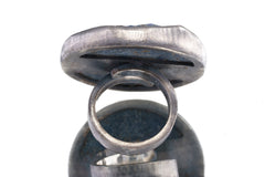 Back view of XXL Lapis Lazuli statement ring showing thick sterling silver setting and large round blue stone.