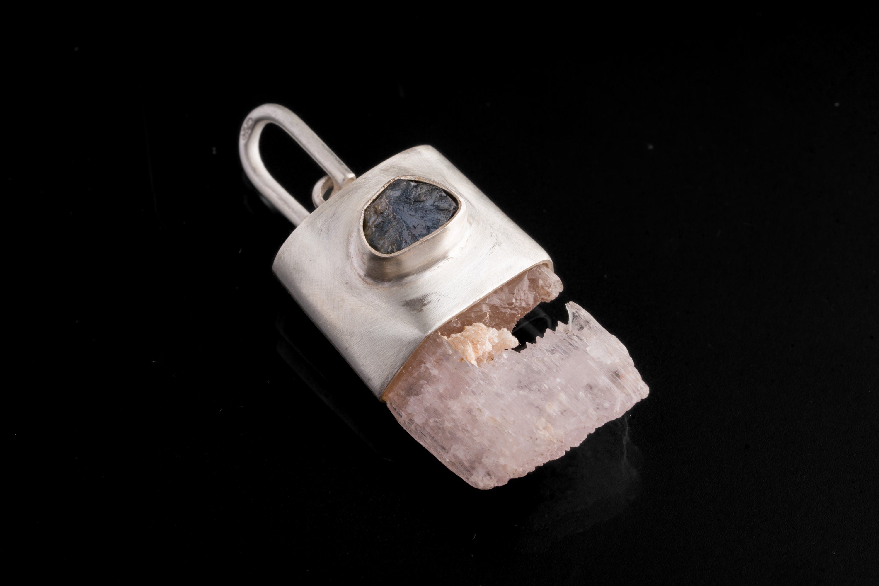 Pink Kunzite Sapphire wand pendant shown on a dark background with brushed 925 sterling silver cap and large hinged bail.