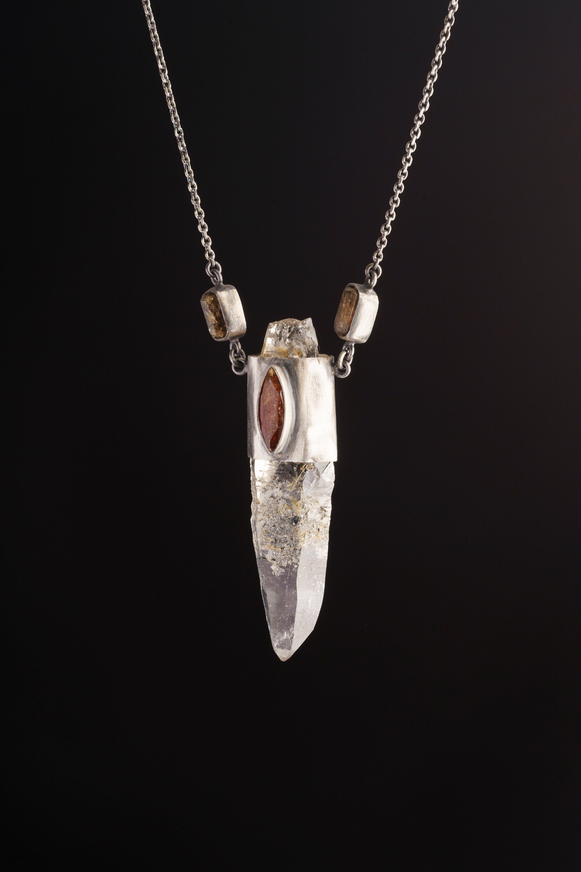 Himalayan Vision Pendant shown on black background with long Himalayan Quartz point and oxidized sterling silver hoop chain.