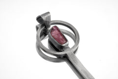 Rubellite Tourmaline spoon pendant shown on white background with solid 925 sterling silver and deep pink gemstone setting.