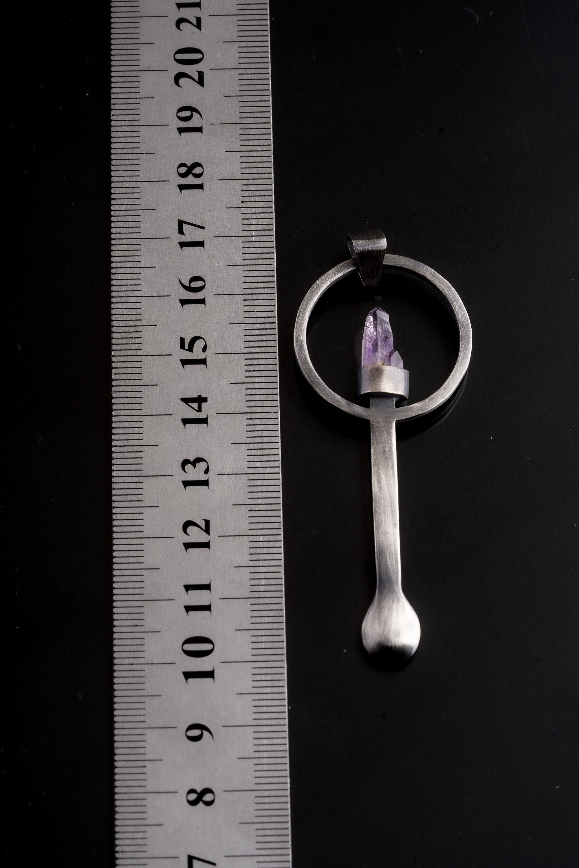 Twin Vera Cruz Amethyst sterling silver spoon pendant shown beside a ruler for scale with solid cast silver body.