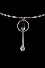 Black Tourmaline sterling silver spoon pendant shown on a choker with hammered silver and dark stone setting.