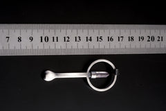 Clear Quartz Generator ritual spoon pendant shown beside a ruler for scale with hammered sterling silver body.