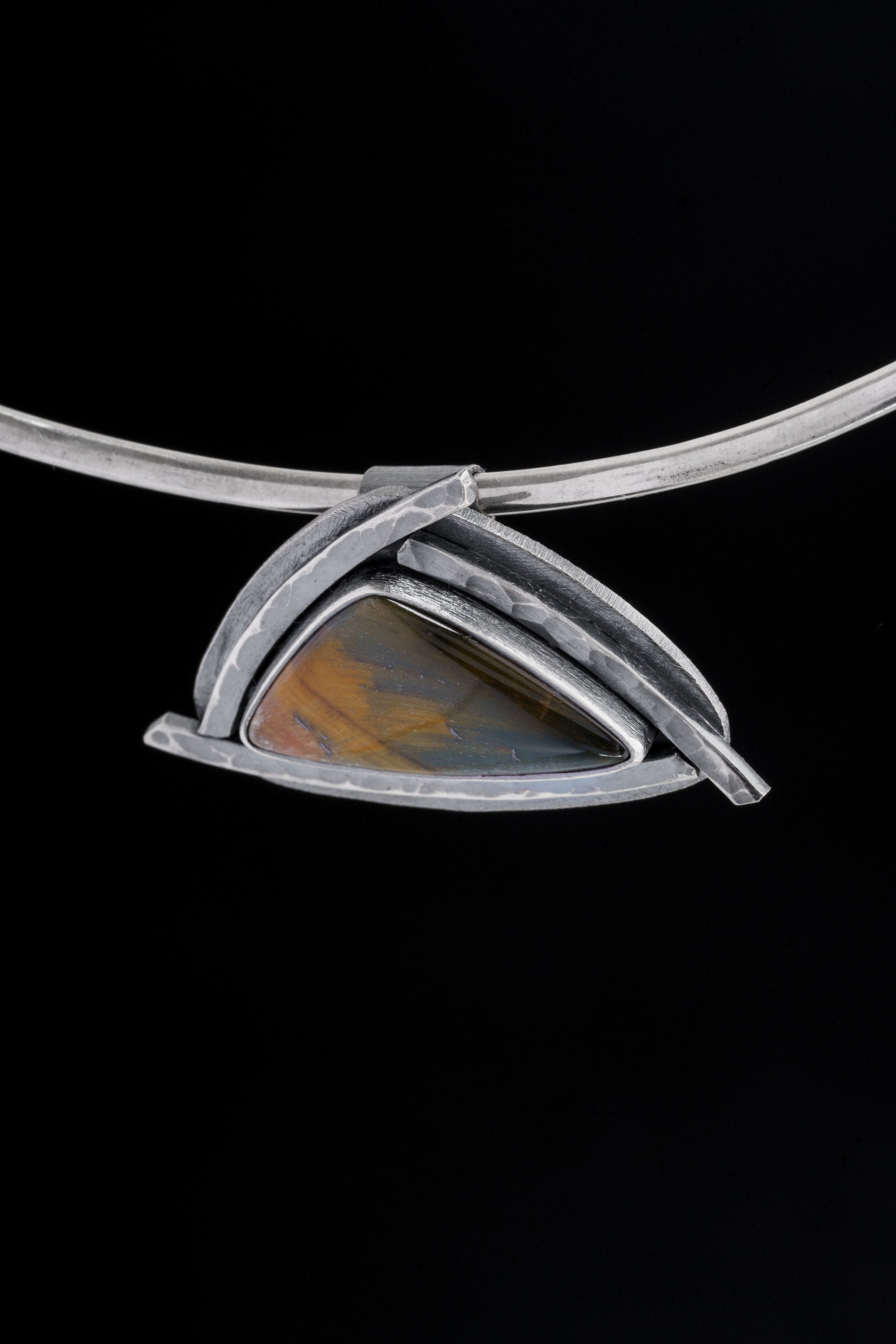 Tiger Eye triangle pendant displayed on a choker with oxidized sterling silver and 4 mm tube bail.