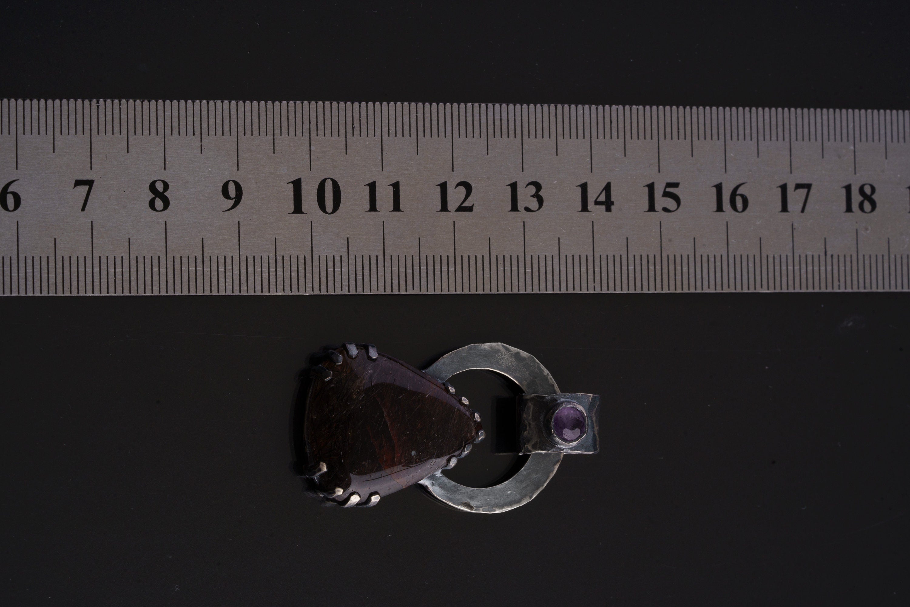 Gem Amethyst Black Rutile Quartz pendant shown beside ruler for approximate size reference.