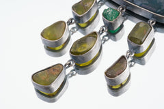Close view of Australian Malachite with Pyrite inclusions in oxidized sterling silver pendant.