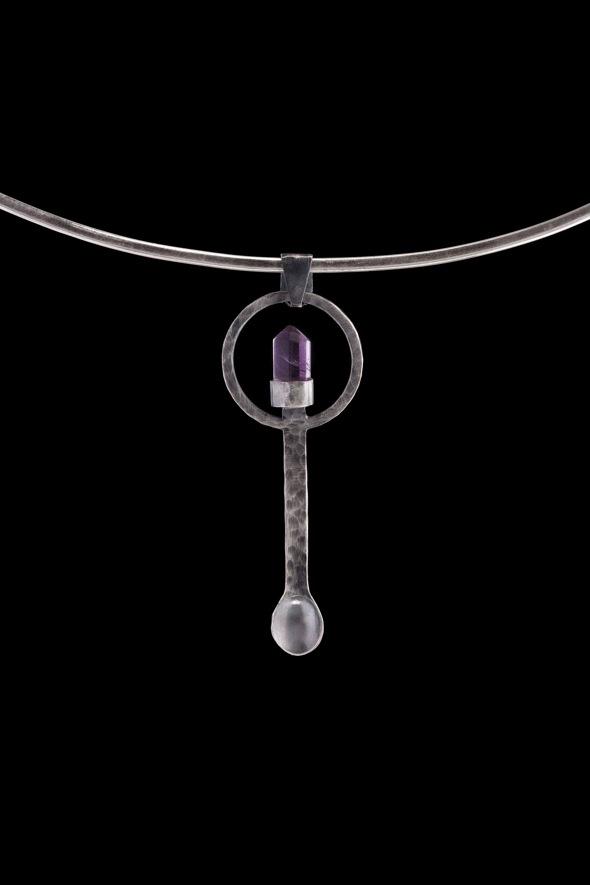 Amethyst Generator silver ritual spoon displayed on a choker, showing wearable talisman styling and spoon form.