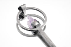 Close-up of Twin Vera Cruz Amethyst spoon pendant showing brush-textured silver and delicate twin crystal setting.