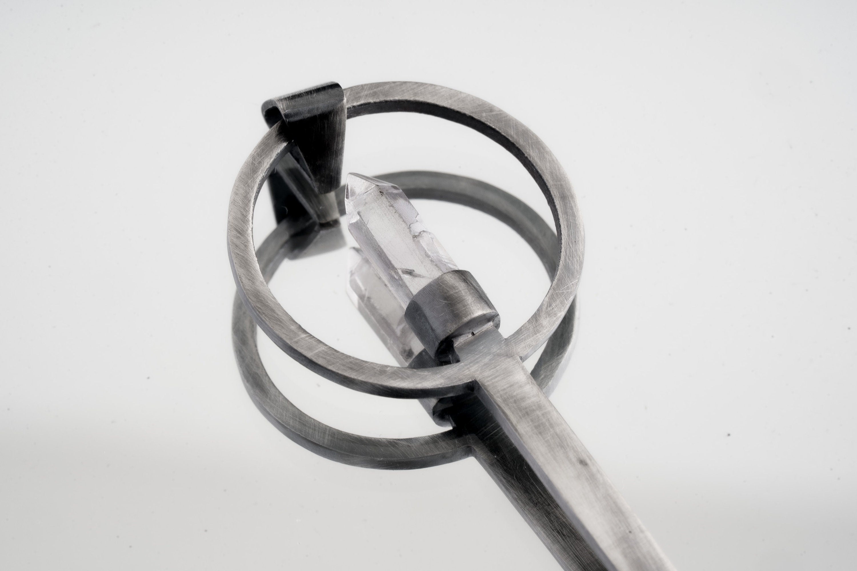 Clear Quartz Generator spoon pendant shown close-up with solid 925 sterling silver and bright crystal point.
