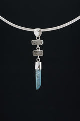 Black Rutile Quartz and Lemurian Aqua Aura pendant displayed on dark background with high-shine sterling silver.