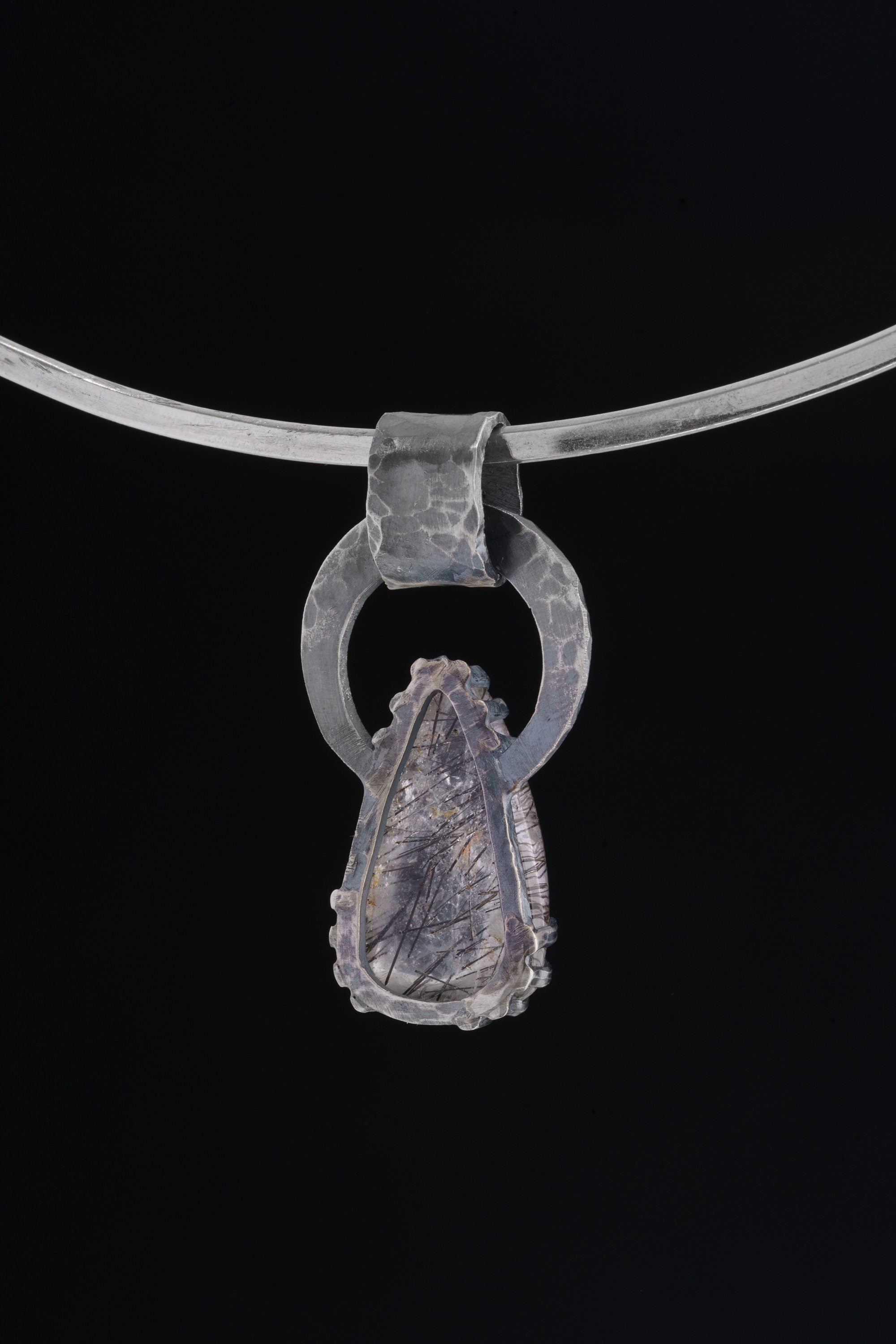 Blue Moonstone Black Rutile Quartz pendant shown on black cord, with large oxidized silver bail and teardrop gemstone.