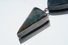 The Soul’s Compass Pendant shown close-up with blue-green Chrysocolla Azurite and sterling silver setting.