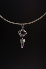 Vera Cruz Amethyst Emerald sphere pendant shown on a black cord, with oxidized sterling silver and sculptural wire sphere.
