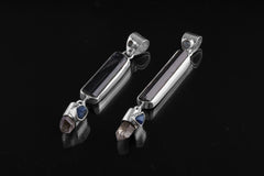 Blue Moonstone Tourmaline Smoky Quartz Sapphire pendant shown on dark background with high-shine sterling silver.