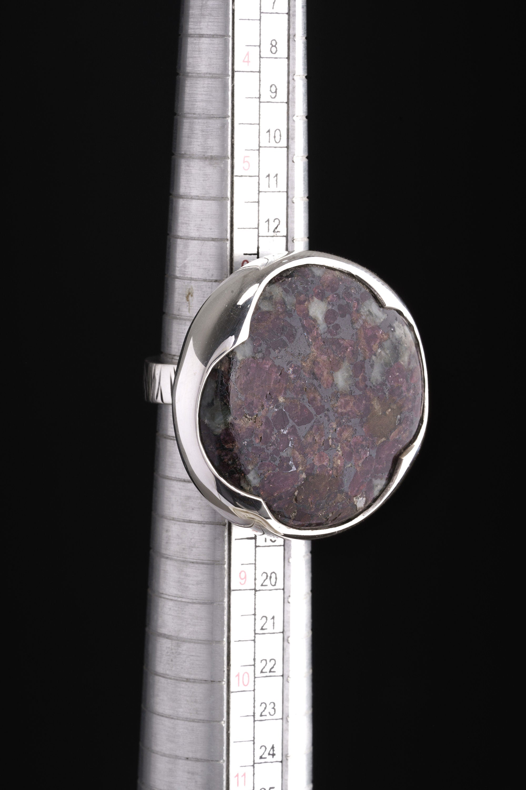 Ruby Mica Quartz Matrix ring shown beside a ruler for scale, with adjustable 925 sterling silver band.
