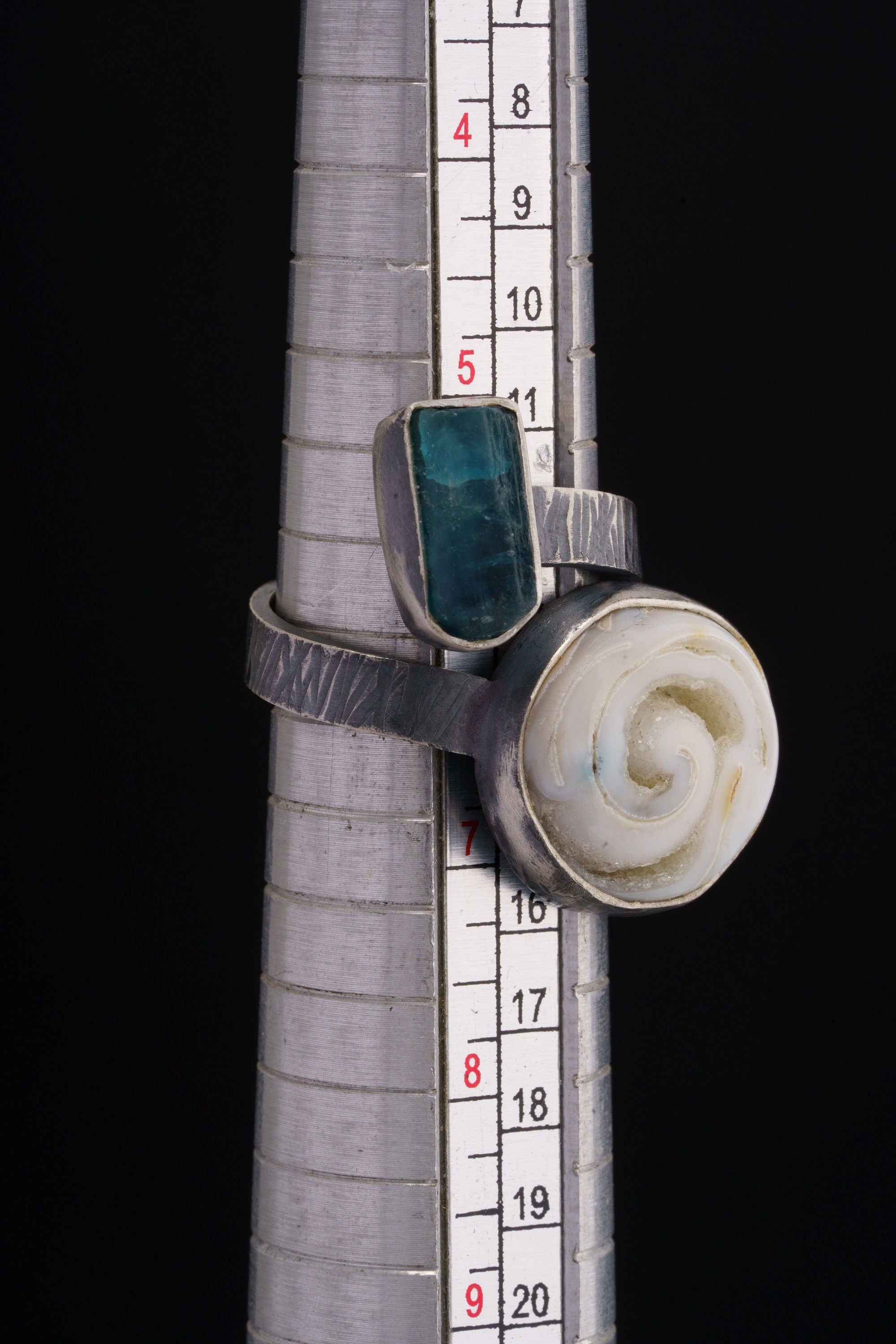 Land and Sea Apatite Shell ring shown beside a ruler for scale, with adjustable sterling silver open band.