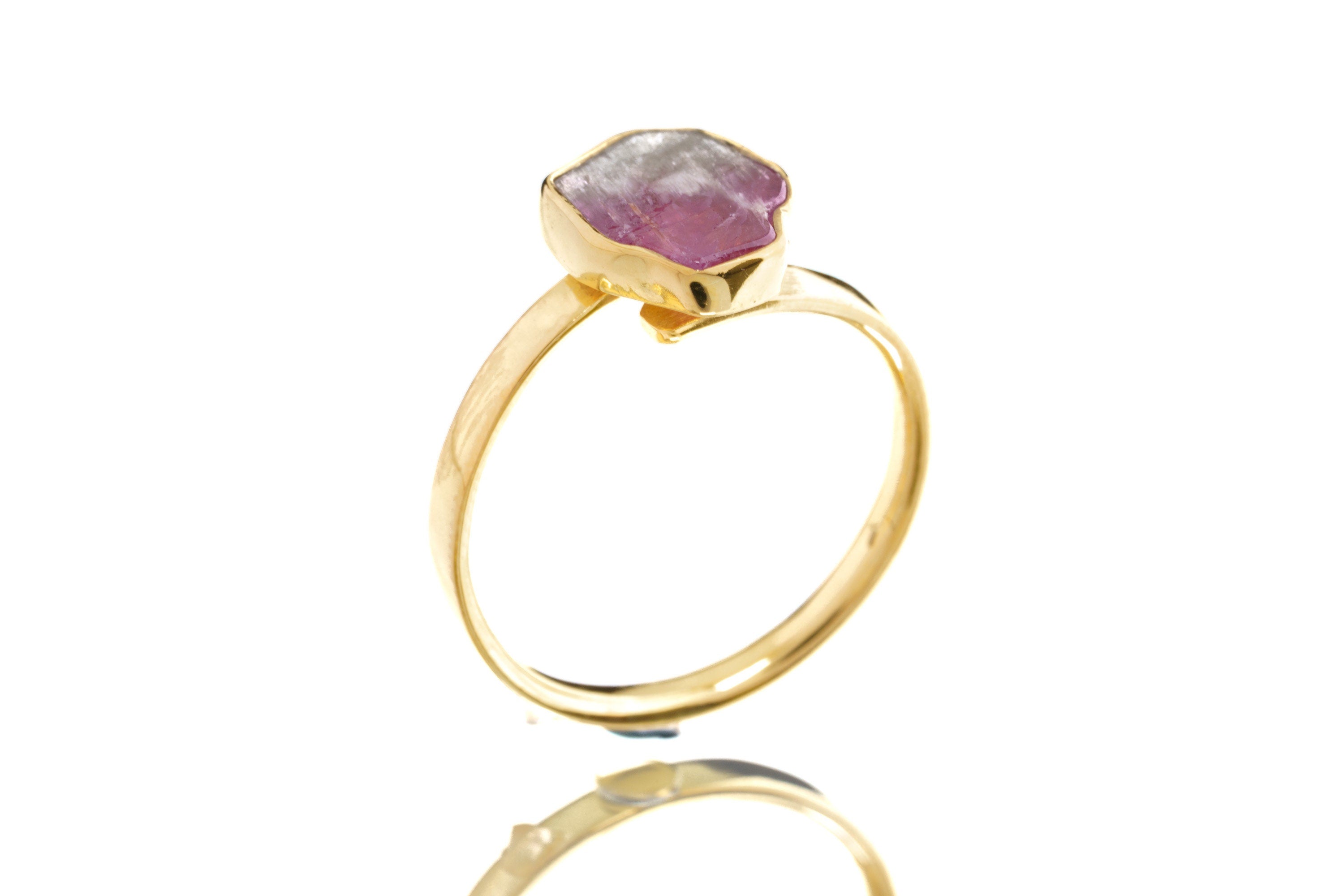 Side view of Watermelon Tourmaline stack ring showing the raised pink green stone and warm gold-plated setting.