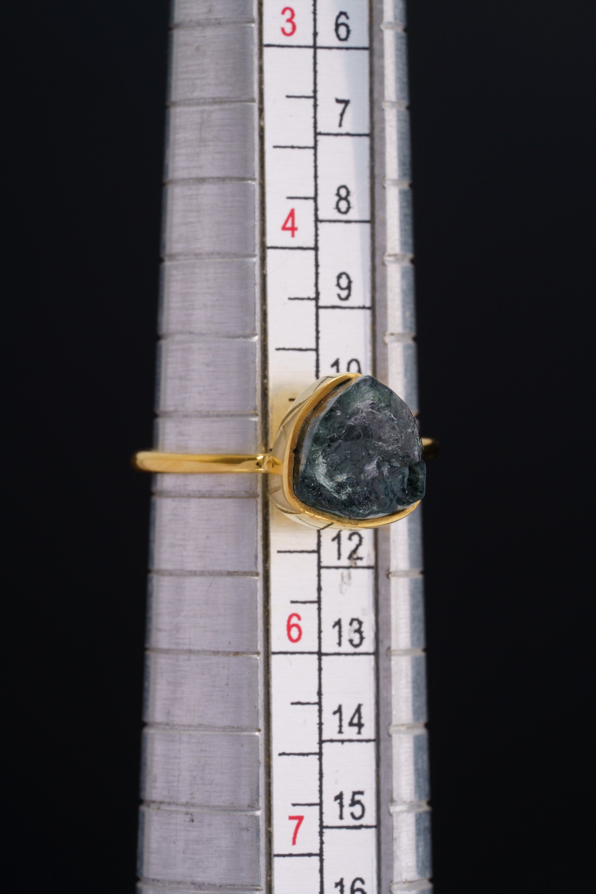 Blue Tourmaline Indicolite ring shown on a mandrel for size reference, appearing around US size 5.5 to 6.