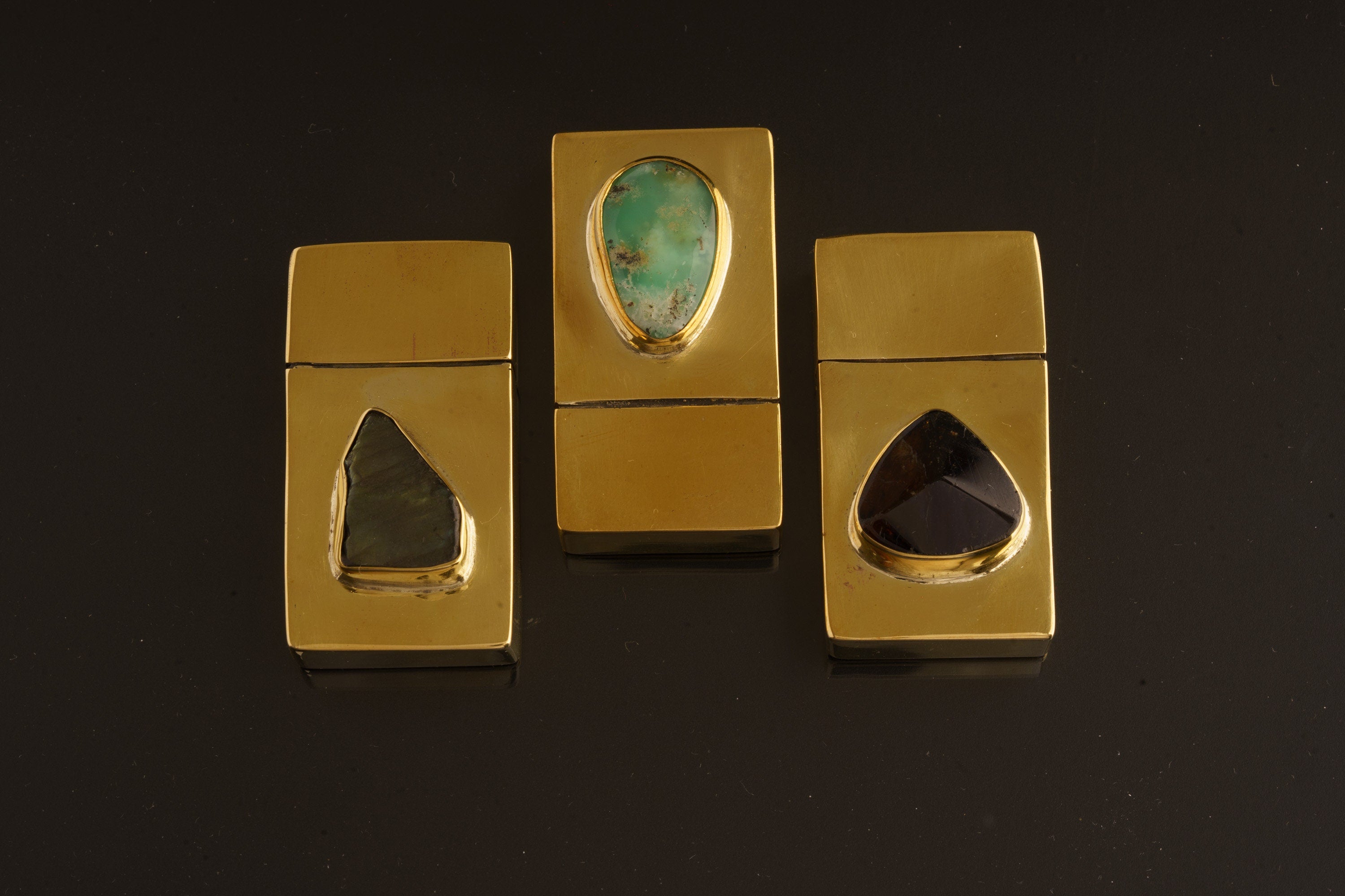 Amethyst brass keepsake box shown from above with gemstone lid detail and compact matchbox shape.