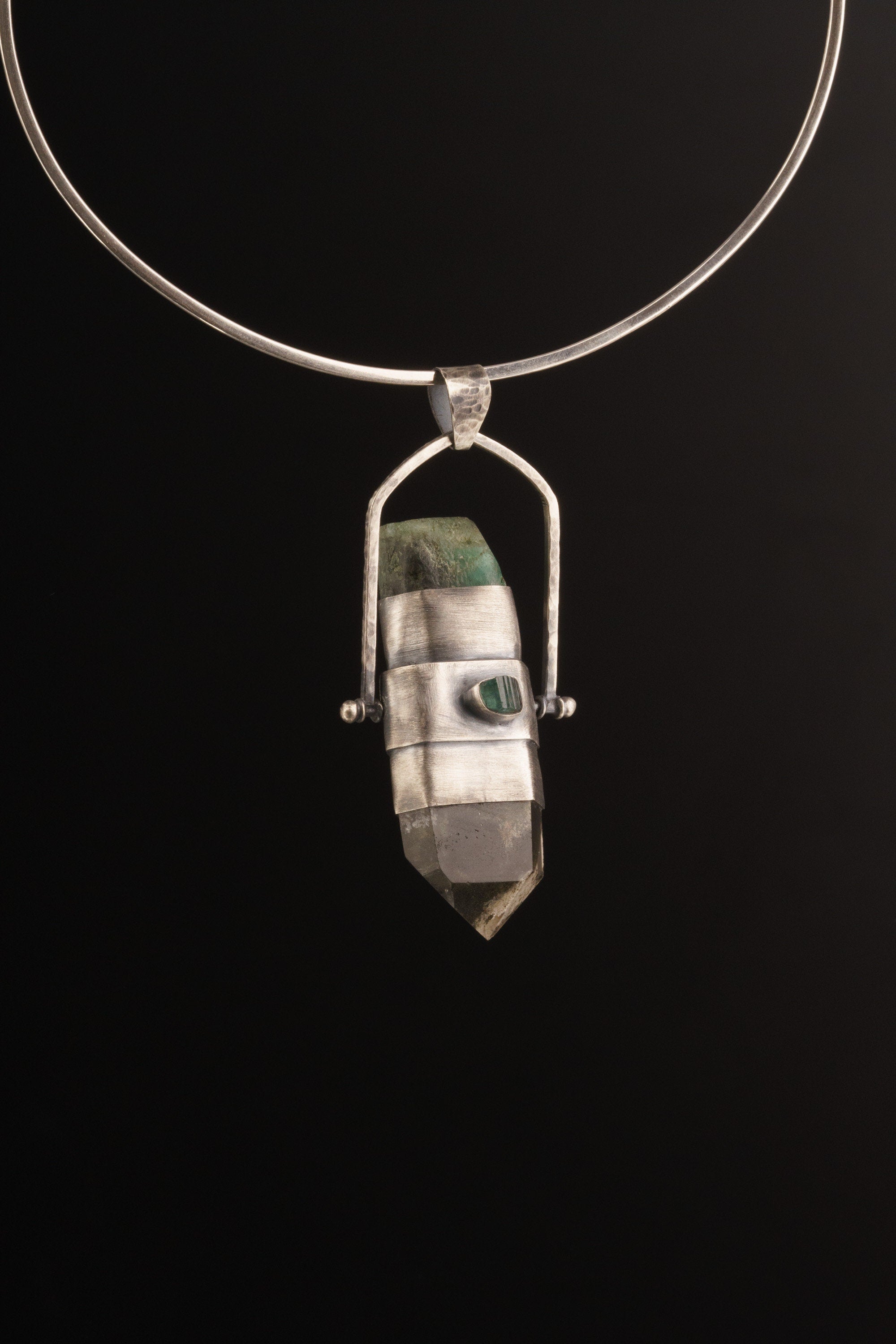 Large spinner pendant shown on a dark background with Australian Emerald side, black cotton cord, and oxidized sterling silver bezel.