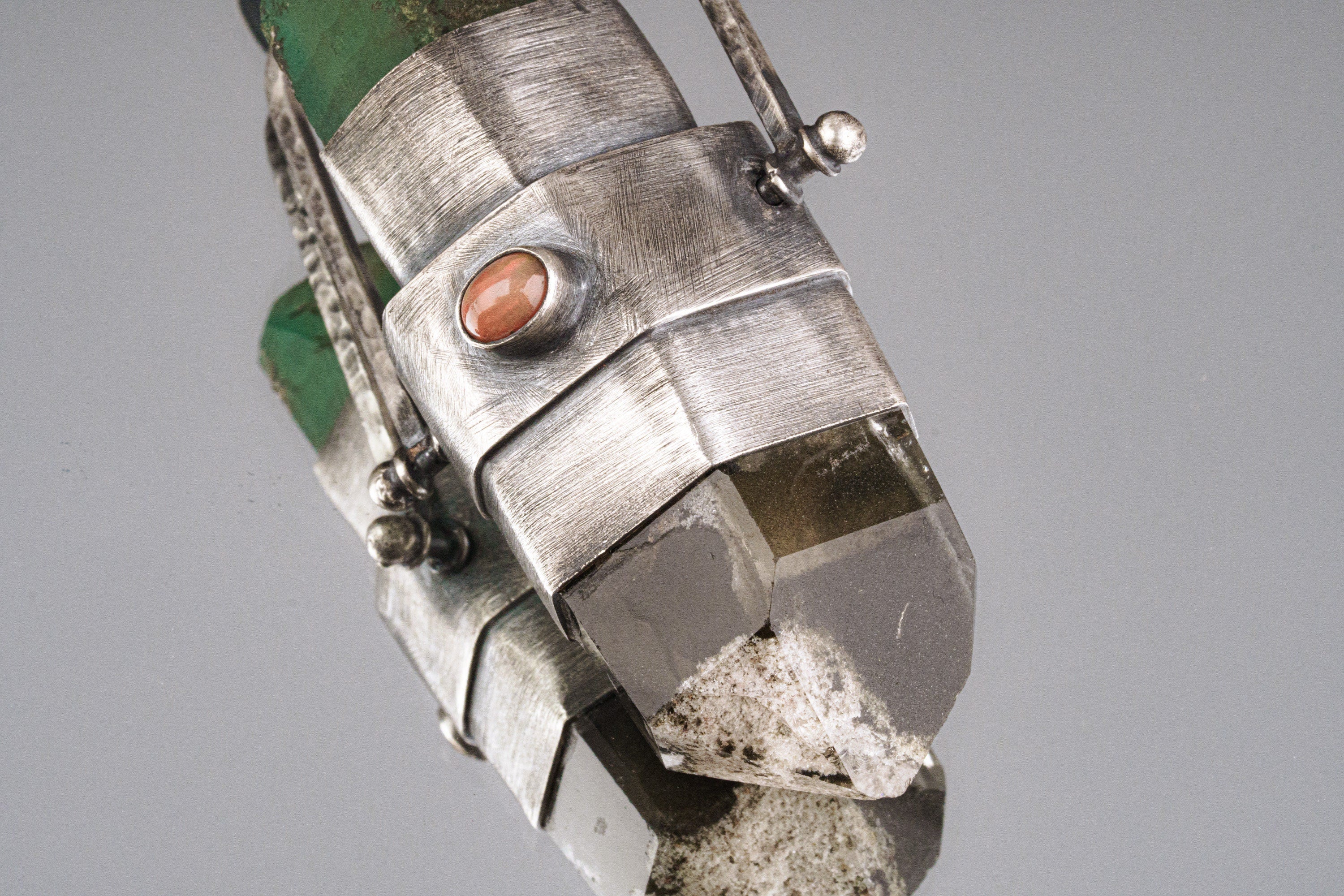 Close-up of Phantom Chlorite Quartz of a large, oxidized sterling silver spinner pendant with thick handmade bezel.