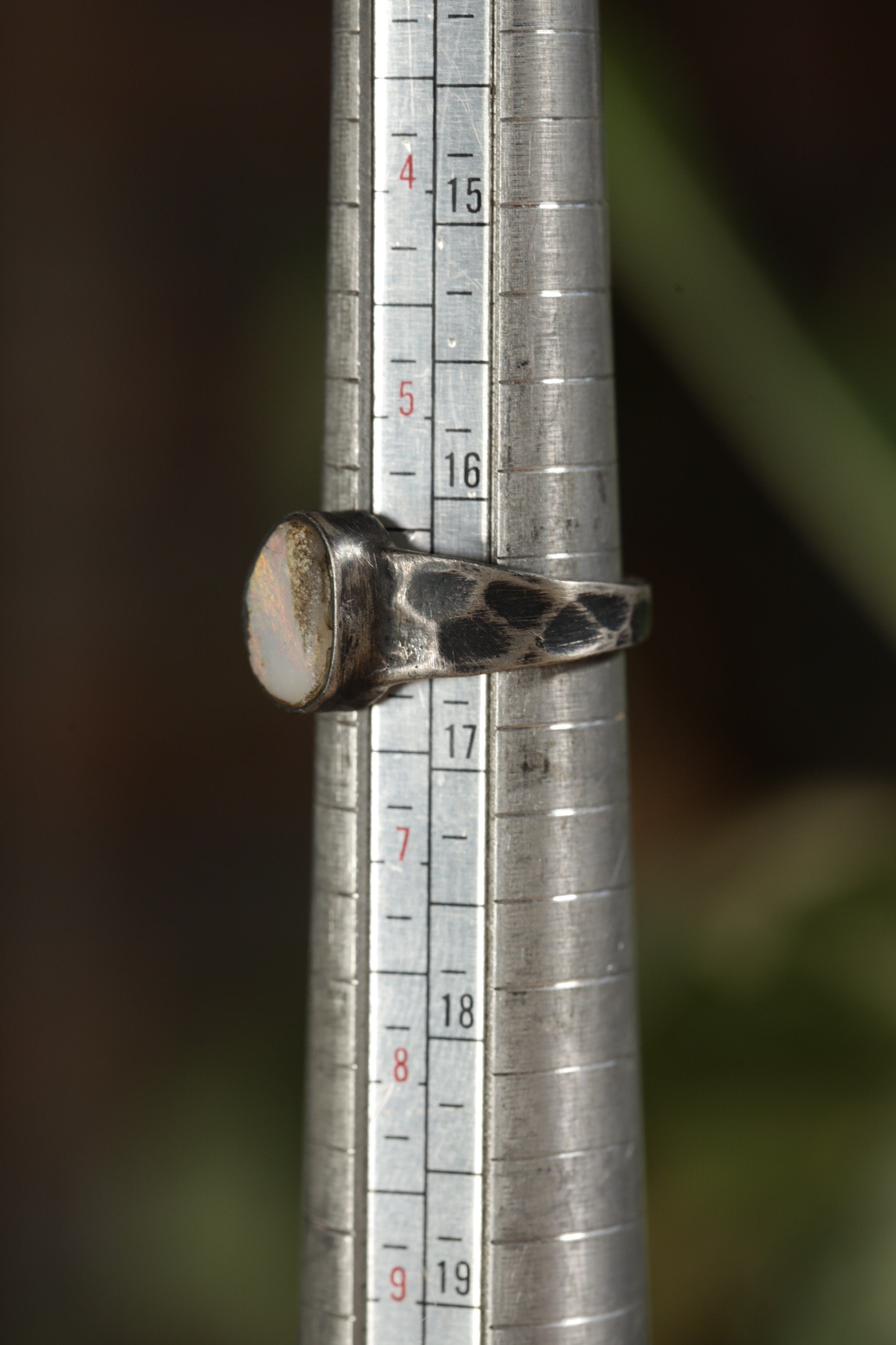 Lightning Ridge Opal sterling silver ring shown on a mandrel for size reference, appearing around US size 6 to 6.5.