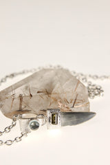 Megalodon Tooth Aquamarine Green Tourmaline pendant shown hanging on a model, with sand-textured sterling silver and ocean fossil design.