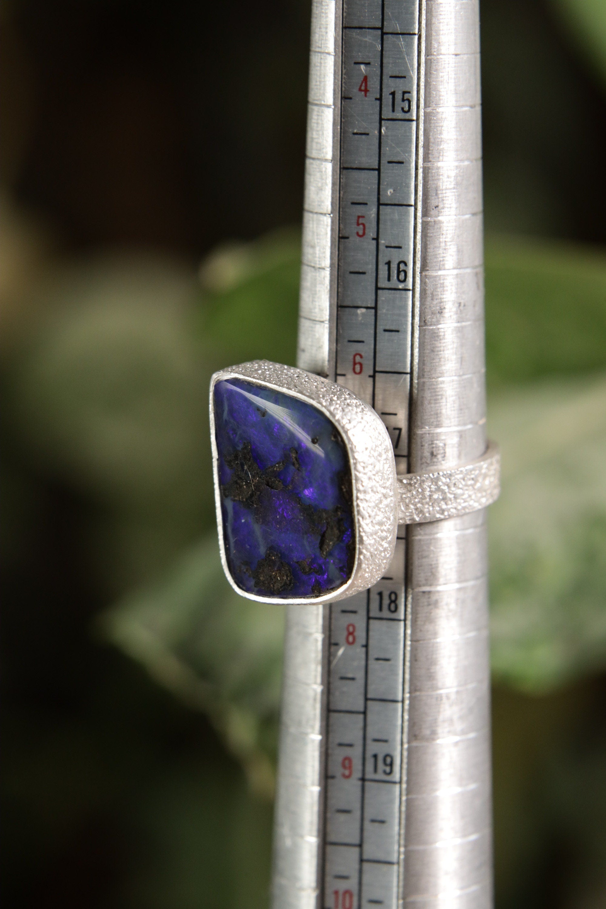 Square Opal adjustable ring shown beside a ruler for scale, with high-shine 925 sterling silver band and textured finish.