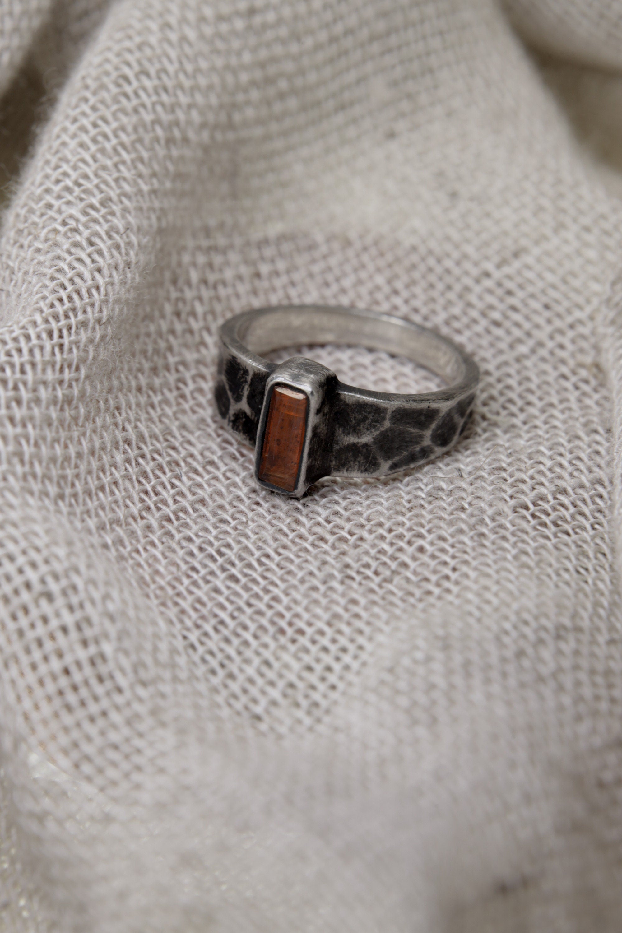 Crimson Whisper: Sterling Silver Ring with Faceted Red Kyanite - Textured & Oxidised - Size 7