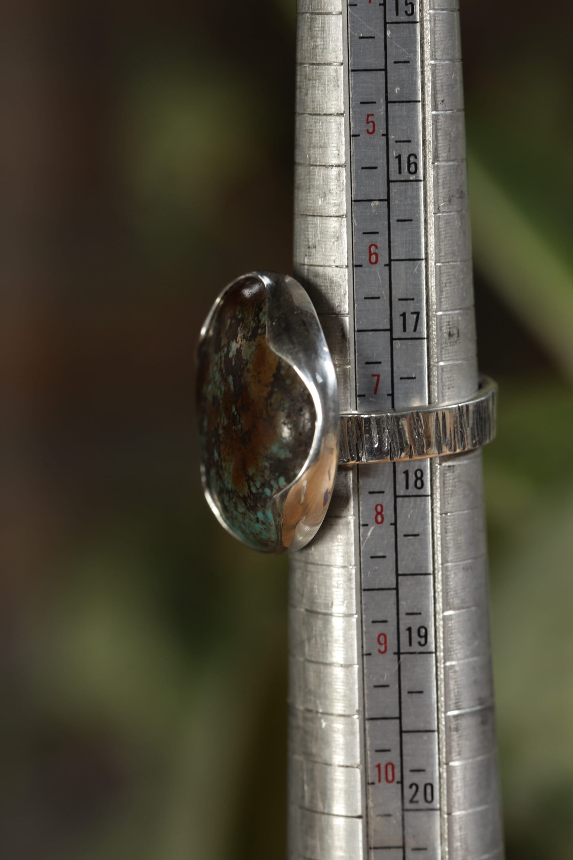 Himalayan Turquoise adjustable ring shown beside a ruler for scale, with high-shine 925 sterling silver band.