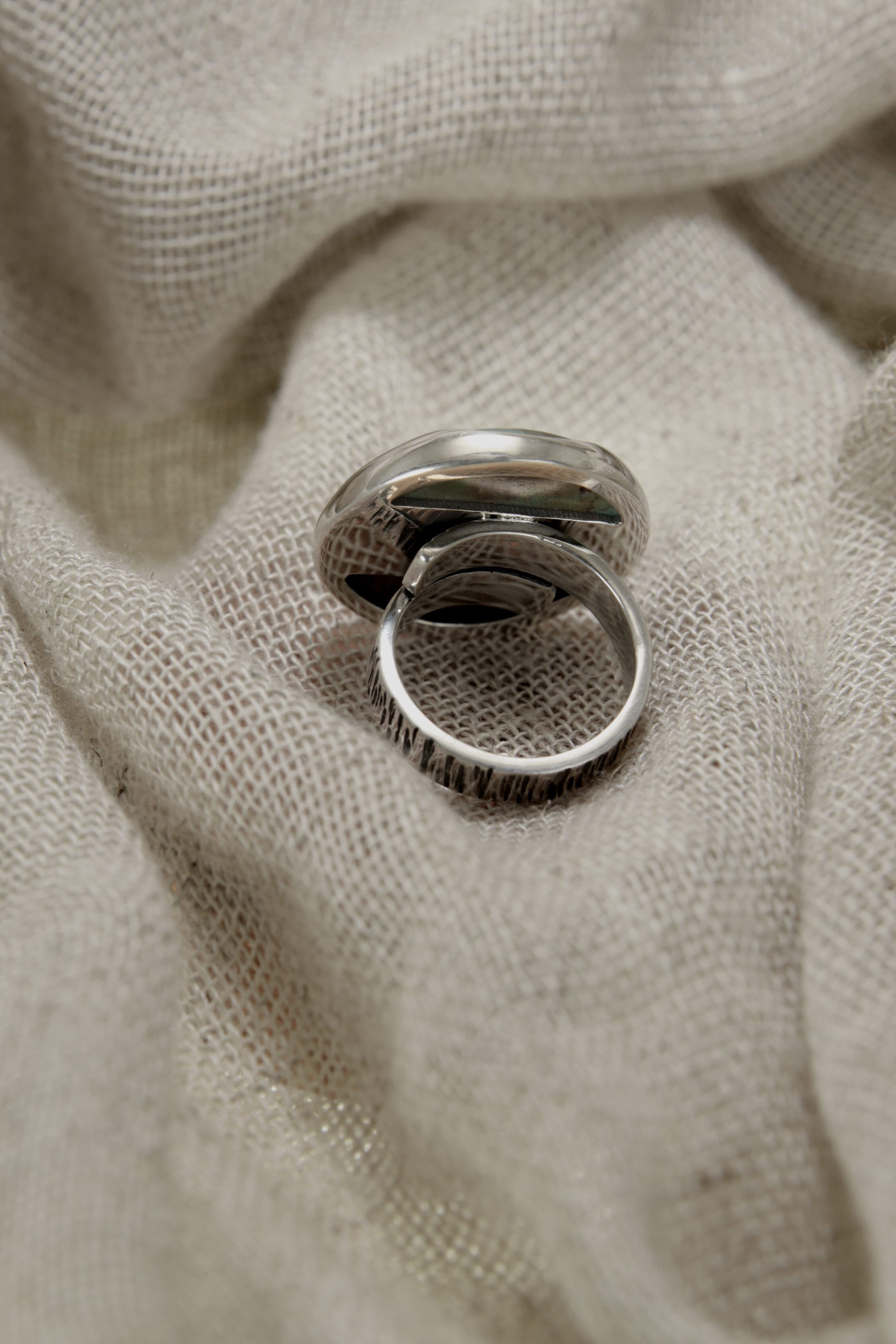 Close-up of Himalayan Turquoise in a waved bezel sterling silver ring, showing natural veining and matrix patterning.