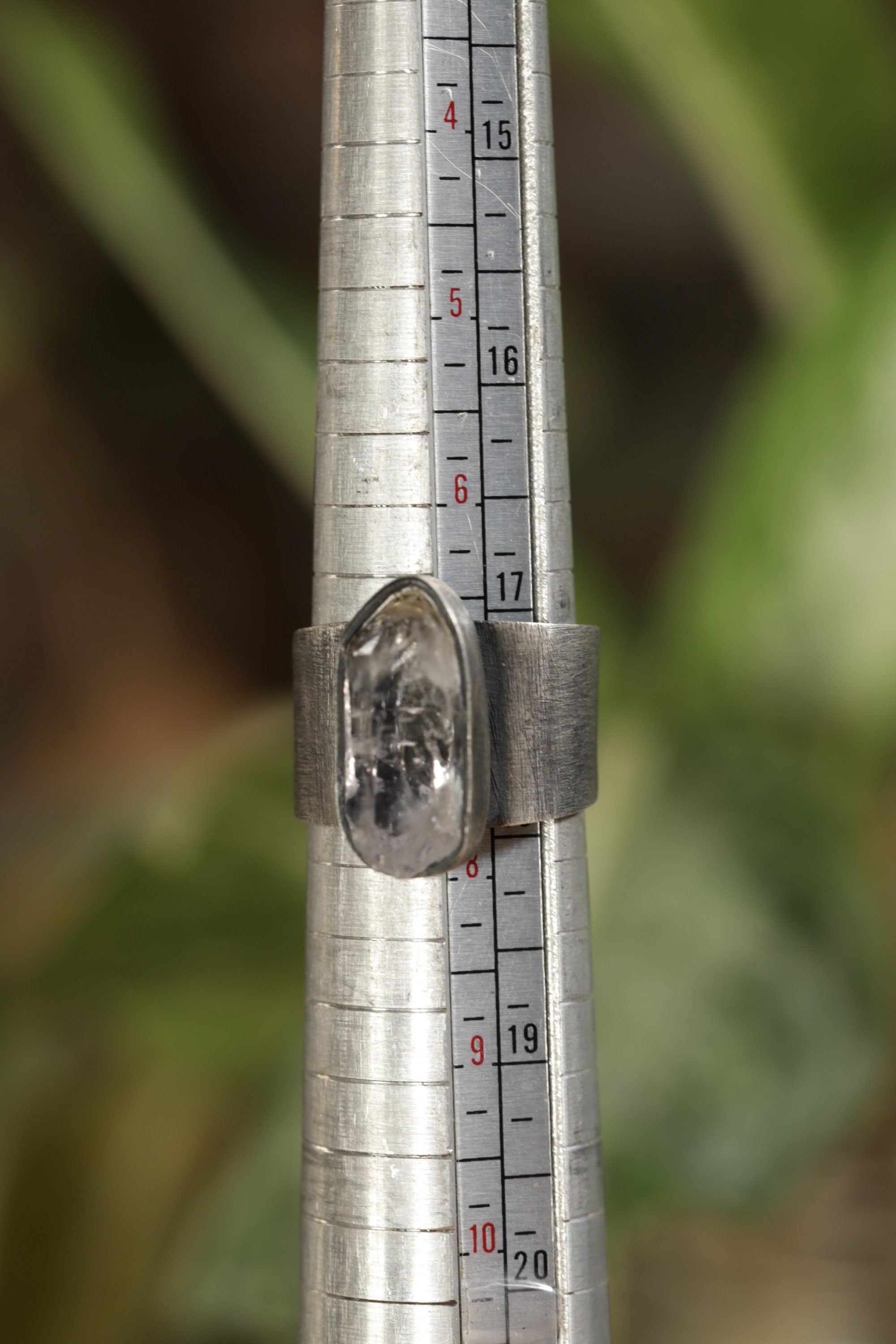 Vera Cruz Amethyst adjustable ring shown beside a ruler for scale, with oxidized 925 sterling silver band.