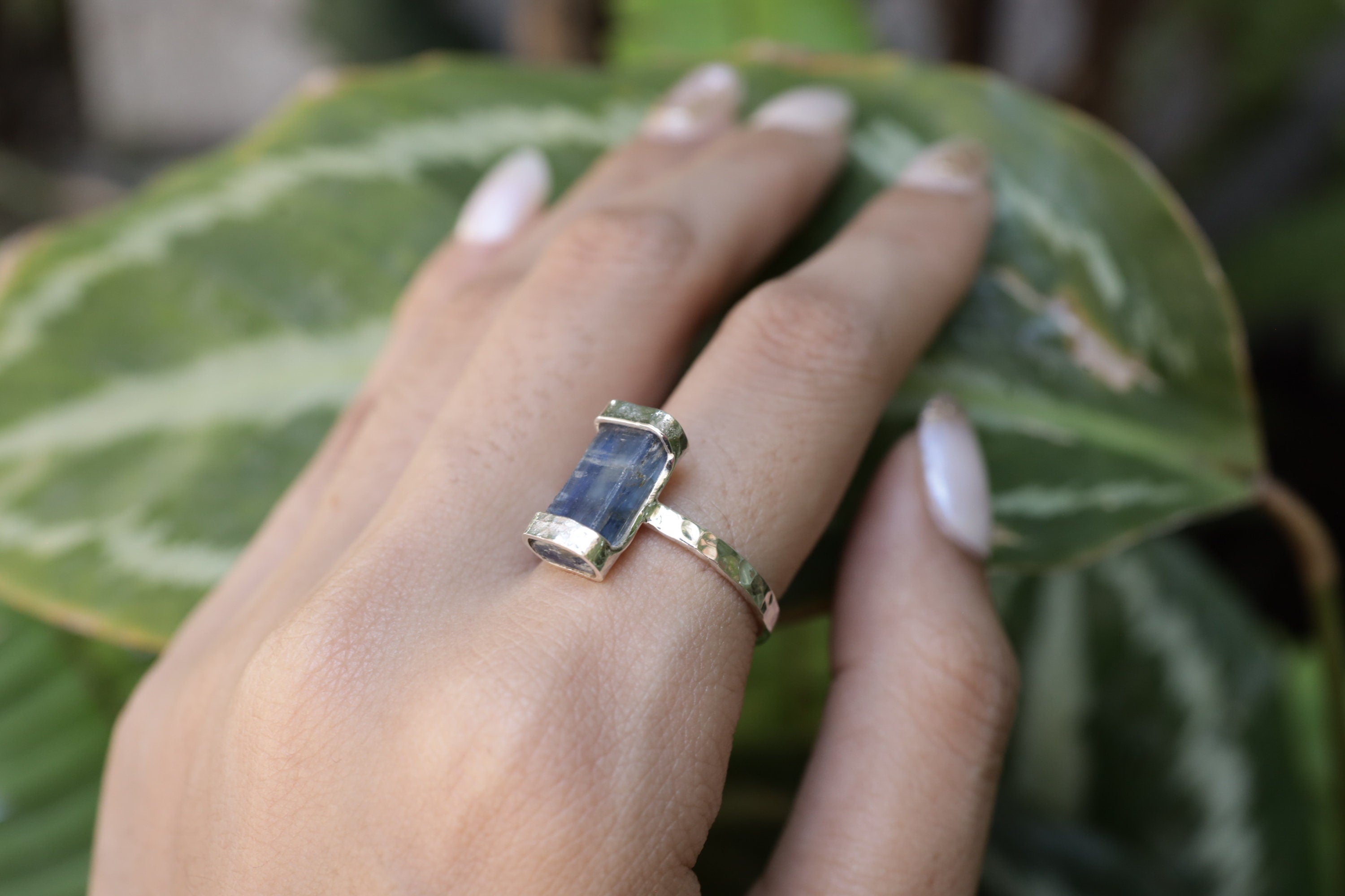 Australian Ocean Kyanite ring shown worn on the hand as a deep blue Throat Chakra gemstone ring in oxidized silver.